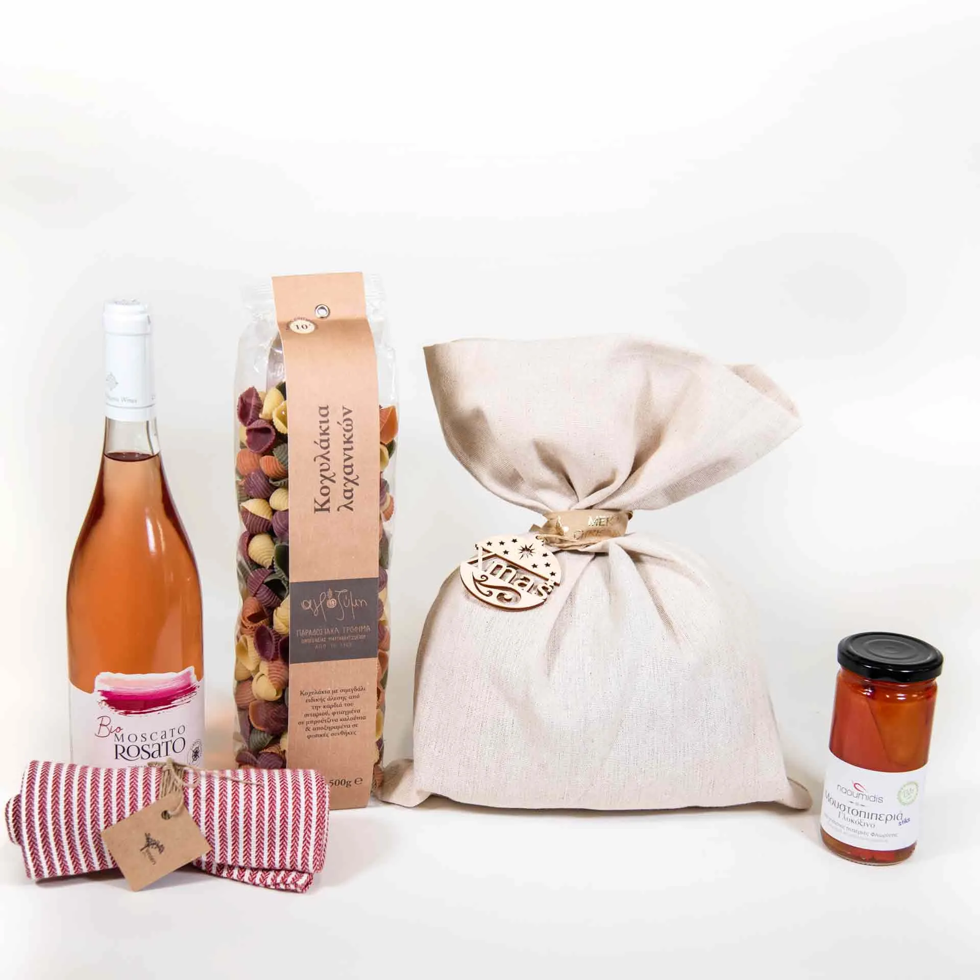 wine, pasta, linen punch and peppers in a jar