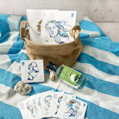 Summer corporate gift basket with mastic liqueur, coaster and towel