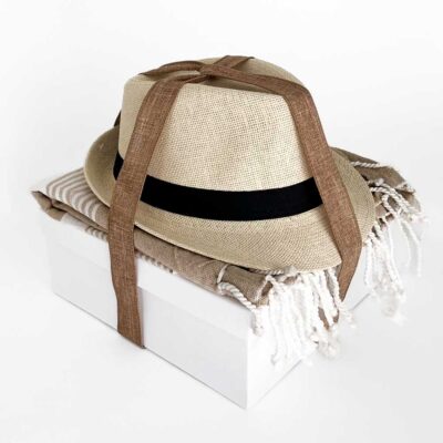 Gift box with coctail, hat and a towel