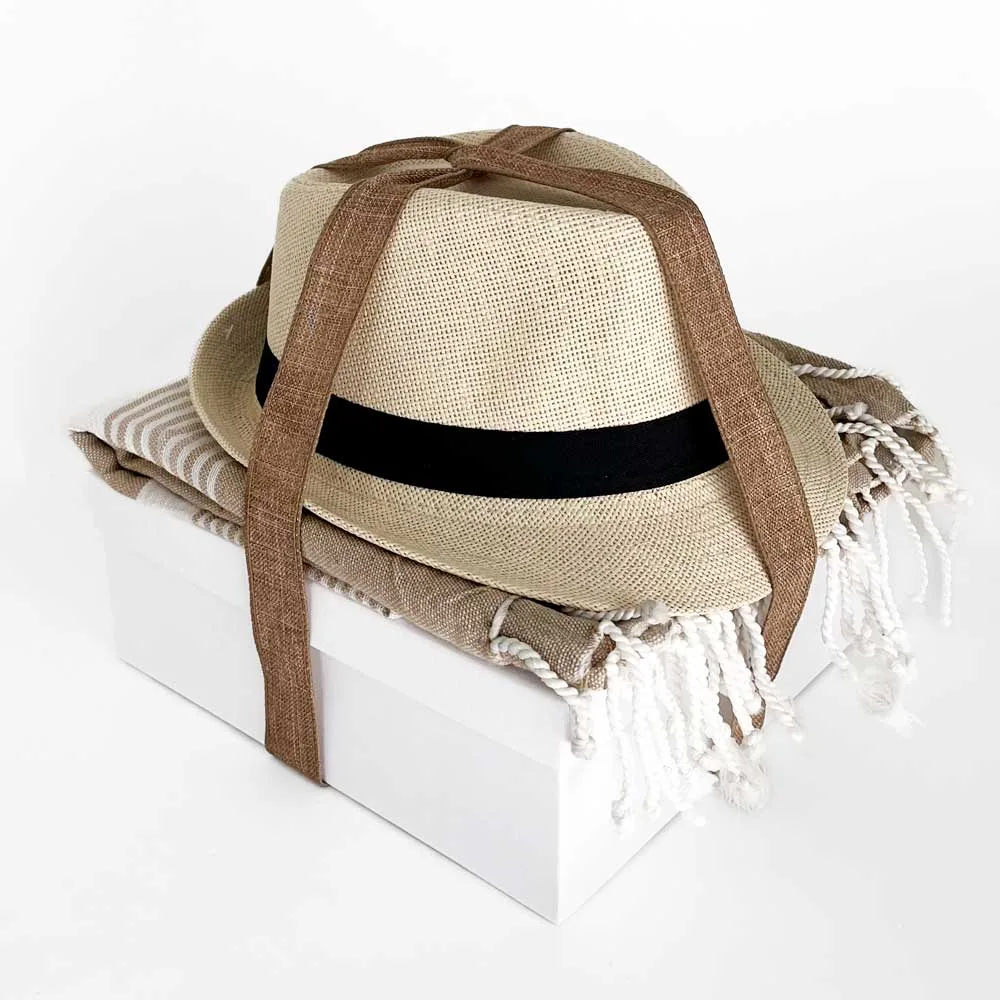 Gift box with coctail, hat and a towel