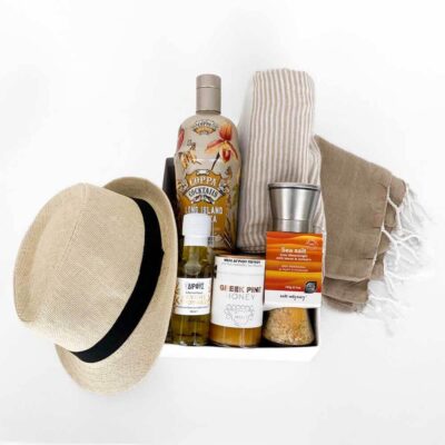 Gift box with coctail, hat and a towel