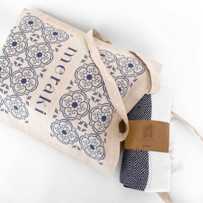 corporate gift with a customized handbag and a beach towel