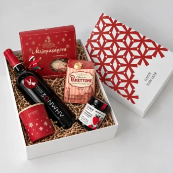 Christmas gift with wine, macarons and a candle