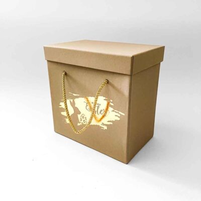 a brown box with a gold handle