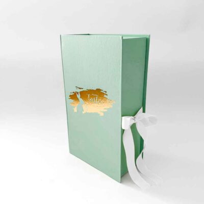 a green box with a white bow