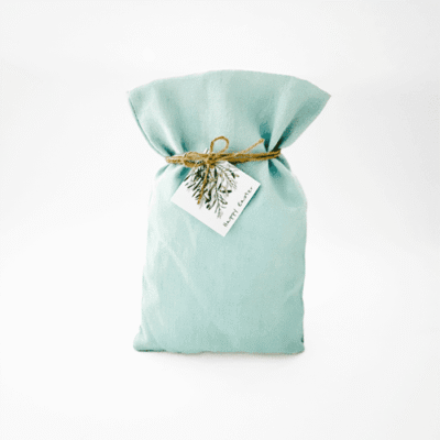 a blue bag with a tag