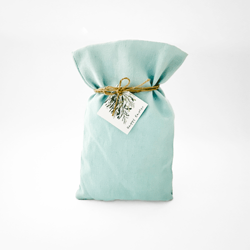 a blue bag with a tag