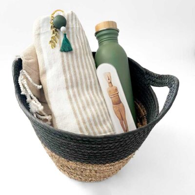 Basket with thermos, bookmark and towel