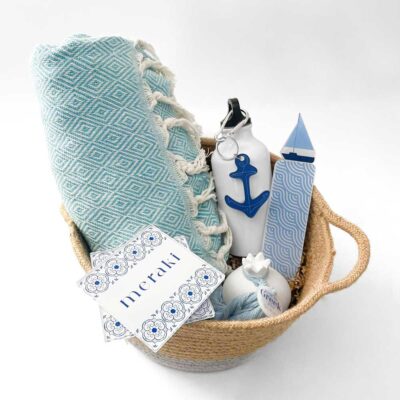 Basket with coasters, towel and thermos