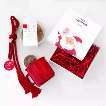 Christmas box with gingerbread, lucky charm, mug and chocolate ball