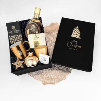 Christmas gift with whiskey, chocolate, honey and candle